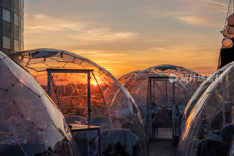 Sunset over street café domes in Bucharest